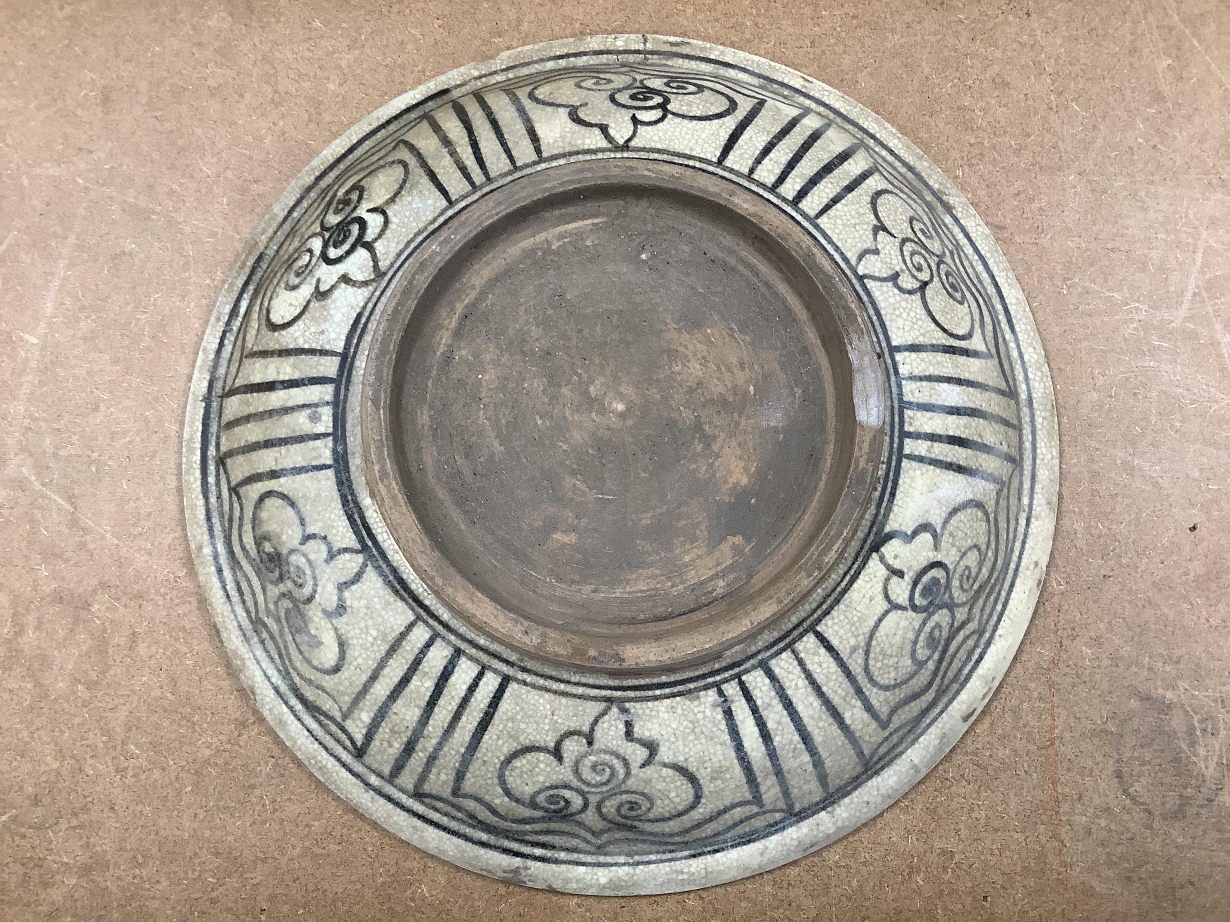 A group of Thai ceramic dishes, possibly Sukothai, largest 36cm